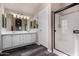 Spacious bathroom with dual sinks, and stand up shower with glass door at 3301 S Goldfield Rd # 6050, Apache Junction, AZ 85119