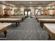Spacious billiards room filled with multiple tables, providing ample space for residents to enjoy a game of pool at 3301 S Goldfield Rd # 6050, Apache Junction, AZ 85119