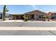 Charming single-story home with a covered porch and well-maintained landscaping at 3301 S Goldfield Rd # 6050, Apache Junction, AZ 85119