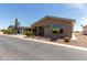 Attractive single-story residence with a covered porch and desert-friendly landscaping at 3301 S Goldfield Rd # 6050, Apache Junction, AZ 85119
