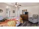 Comfortable main bedroom featuring a decorative bed, stylish furniture, and a large mirror at 3301 S Goldfield Rd # 6050, Apache Junction, AZ 85119