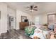 This main bedroom is well-lit, has a ceiling fan, and includes a view of the en suite bathroom at 3301 S Goldfield Rd # 6050, Apache Junction, AZ 85119