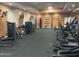 Weight room featuring treadmills, elliptical machines, weights, and exercise equipment for residents at 3301 S Goldfield Rd # 6050, Apache Junction, AZ 85119