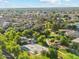 Wide aerial view showcases an extensive Primary-planned community with lush landscaping and numerous neighborhood amenities at 3574 E Latham Way, Gilbert, AZ 85297