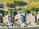 Top-down aerial view showcasing a refreshing backyard pool and lush green landscaping in a neighborhood at 3574 E Latham Way, Gilbert, AZ 85297