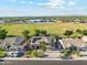 Aerial view of a residential area, featuring a lush park with a huge lawn nearby homes at 3574 E Latham Way, Gilbert, AZ 85297
