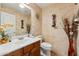 Cozy bathroom featuring decorative tilework, wood vanity, and decorative accents at 3574 E Latham Way, Gilbert, AZ 85297