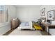 Bright bedroom boasts a modern decor with natural light, featuring a comfortable bed and functional workspace at 3574 E Latham Way, Gilbert, AZ 85297