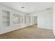 Bright, open bedroom featuring large windows with shutters and built-in shelving for added convenience at 3574 E Latham Way, Gilbert, AZ 85297