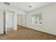 Spacious bedroom with mirrored closet doors and plantation shutters allowing natural light to illuminate the space at 3574 E Latham Way, Gilbert, AZ 85297
