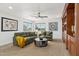 Bonus room with green sofa, built-in shelves, and natural light at 3574 E Latham Way, Gilbert, AZ 85297