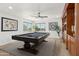 Bonus room features pool table, modern lighting, and shelving at 3574 E Latham Way, Gilbert, AZ 85297
