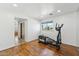 Bright, airy room featuring wood floors and an elliptical machine at 3574 E Latham Way, Gilbert, AZ 85297