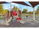 Colorful playground featuring slides and climbing structures, offering a fun and safe recreational area for children at 3574 E Latham Way, Gilbert, AZ 85297