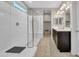 Bright bathroom with a walk-in shower, double sinks, and modern fixtures at 38150 W San Sisto Ave, Maricopa, AZ 85138