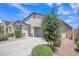 Attractive single-Gathering home featuring desert landscaping, a paved driveway and a two-car garage at 38150 W San Sisto Ave, Maricopa, AZ 85138