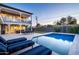 Inviting backyard featuring a sparkling pool, comfortable lounge chairs, and a serene outdoor space at 3824 N 50Th Pl, Phoenix, AZ 85018