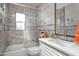 Bathroom with glass enclosed shower and a single sink vanity and a view to the exterior at 3824 N 50Th Pl, Phoenix, AZ 85018