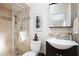 Bathroom with walk-in shower, unique decor and a dark colored vanity at 3824 N 50Th Pl, Phoenix, AZ 85018