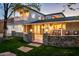 Elegant two-story home with stone accents, covered porch, well-lit with manicured lawn, and a warm inviting ambiance at 3824 N 50Th Pl, Phoenix, AZ 85018
