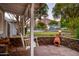 Relaxing covered front porch with a swing, stone detailing, and a view of the neighborhood's peaceful surroundings at 3824 N 50Th Pl, Phoenix, AZ 85018