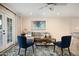 Bright living room features a comfortable seating arrangement, stylish decor, and French doors that let in natural light at 3824 N 50Th Pl, Phoenix, AZ 85018