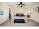 Main bedroom suite includes access to ensuite bathroom, ceiling fan and neutral colors at 3824 N 50Th Pl, Phoenix, AZ 85018