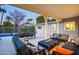 Charming covered patio with stylish seating, a dining area, and a relaxing outdoor ambiance at 3824 N 50Th Pl, Phoenix, AZ 85018