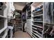 Spacious walk-in closet with custom shelving and ample storage for clothes and accessories at 3824 N 50Th Pl, Phoenix, AZ 85018