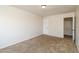 Neutral-colored bedroom with carpet flooring, a standard ceiling light, and a white door at 409 E Saddle Way, San Tan Valley, AZ 85143