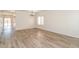 Open dining area with wood-look floors and a modern chandelier at 409 E Saddle Way, San Tan Valley, AZ 85143