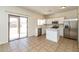 Well-lit kitchen featuring white cabinetry, stainless steel appliances and an island at 409 E Saddle Way, San Tan Valley, AZ 85143