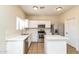 The updated kitchen offers ample counter space, stainless steel appliances and a modern design at 409 E Saddle Way, San Tan Valley, AZ 85143