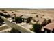 A picturesque aerial view of a charming neighborhood in a beautiful desert community at 44236 W Adobe Cir, Maricopa, AZ 85139