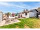 Spacious backyard featuring a pool, seating area, and well-maintained lawn at 4441 W Windrose Dr, Glendale, AZ 85304