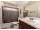 Clean bathroom with a shower-tub combo and single sink vanity at 4441 W Windrose Dr, Glendale, AZ 85304