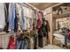 Spacious walk-in closet with double-hanging racks and built-in shelving for optimal storage at 4441 W Windrose Dr, Glendale, AZ 85304