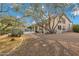 A private backyard with a pool, gravel landscaping, and mature trees create a serene outdoor oasis at 4449 E Rancho Caliente Dr, Cave Creek, AZ 85331