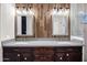 Modern main bathroom with dual vanities, wood paneling, and modern fixtures at 4449 E Rancho Caliente Dr, Cave Creek, AZ 85331