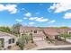 Charming two-story home features a tile roof, an attached garage, and desert landscaping in a Gathering-friendly neighborhood at 4449 E Rancho Caliente Dr, Cave Creek, AZ 85331