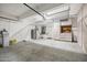 Large garage space with a wall of storage cabinets and overhead rack storage at 4449 E Rancho Caliente Dr, Cave Creek, AZ 85331