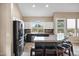 Modern kitchen features stainless steel appliances, a center island and granite countertops at 4449 E Rancho Caliente Dr, Cave Creek, AZ 85331