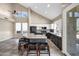Open-concept kitchen featuring a large island with breakfast bar, stainless appliances and vaulted ceilings at 4449 E Rancho Caliente Dr, Cave Creek, AZ 85331