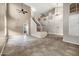 Spacious living room with soaring ceilings, tile floors, a staircase, and ample natural light at 4449 E Rancho Caliente Dr, Cave Creek, AZ 85331