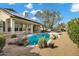 Backyard pool area is surrounded by desert landscaping, and a covered patio at 4449 E Rancho Caliente Dr, Cave Creek, AZ 85331