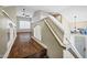 Staircase landing featuring wood flooring, natural light, and views of the living area at 4449 E Rancho Caliente Dr, Cave Creek, AZ 85331