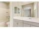 This bathroom boasts a large vanity, shower-tub combo, and neutral finishes at 4853 S Charger --, Mesa, AZ 85212