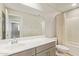 Well-lit bathroom featuring a modern vanity, toilet, and shower with curtain and a large mirror at 4853 S Charger --, Mesa, AZ 85212