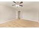 This bedroom features carpeted floors, a ceiling fan, and neutral wall colors at 4853 S Charger --, Mesa, AZ 85212