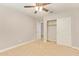 Bright bedroom with neutral walls, carpet, and a closet for ample storage at 4853 S Charger --, Mesa, AZ 85212